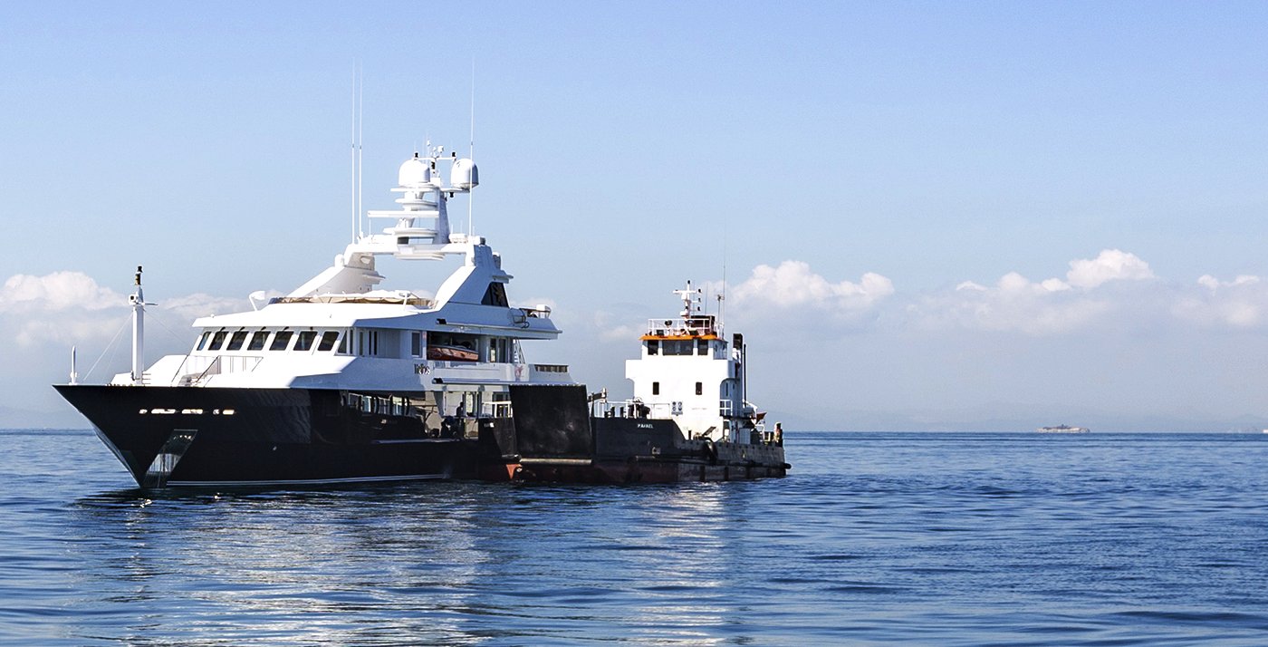 A superyacht made fast alongside the Nolkata Marine landing craft RAFAEL off Panama