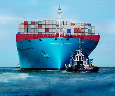 A container ship under tow, physical bunker supply in Panama